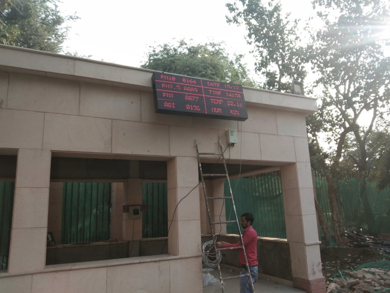 Airveda monitor with LED display installed at construction site.